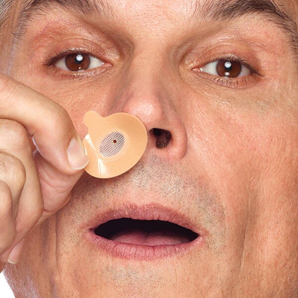 Man Fitting Provent to Nose